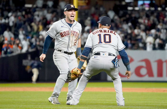 Astros third baseman Alex Bregman celebrates with first baseman Yuli Gurriel after beating the Yankees to clinch the AL pennant.